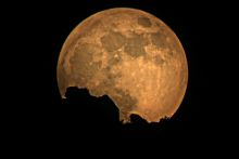 Full moon over mountains