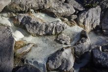 hot springs water running through river rocks