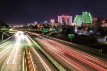 Interstate 80 at night with downtown Reno in background